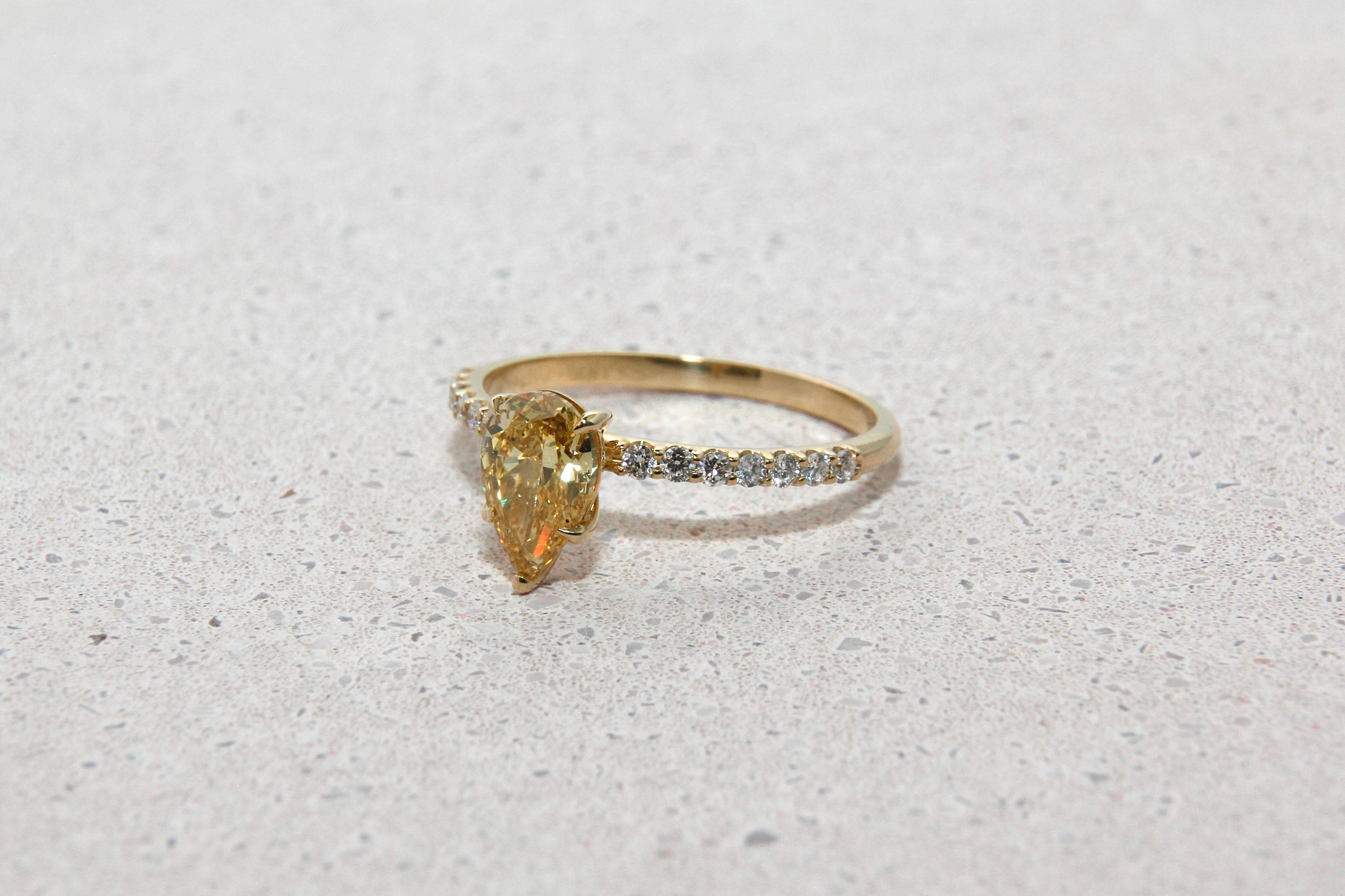 Pear Shape Yellow Fancy Vivid Diamond Ring with Half Eternity